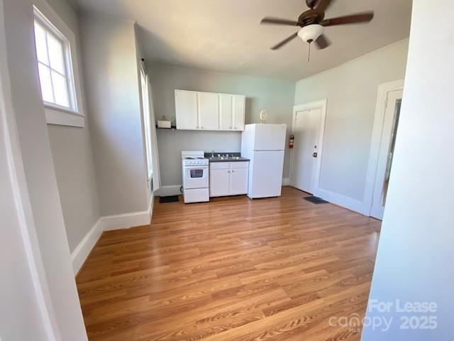 823 Central Avenue Charlotte, NC 28204 - Photo 5 of 14 a view of a kitchen with a sink dishwasher and wooden floor