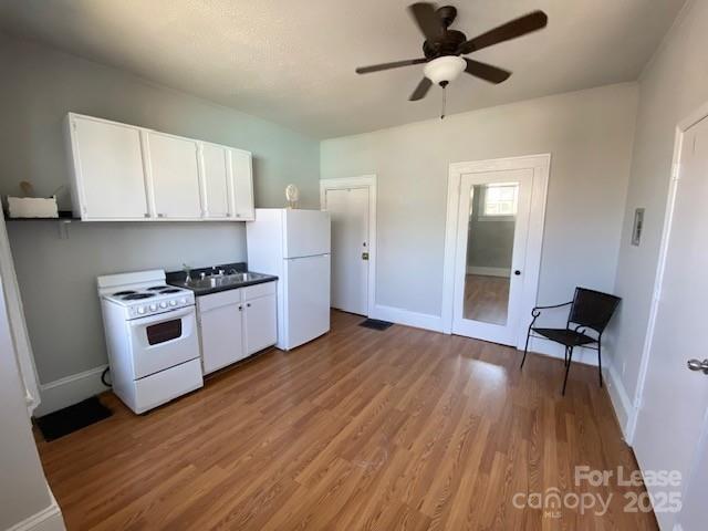 823 Central Avenue Charlotte, NC 28204 - Photo 7 of 14 a kitchen with granite countertop a stove a chimney and a wooden floor