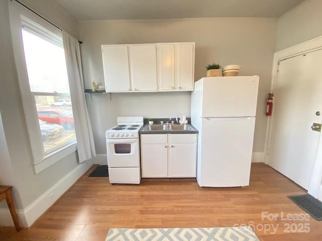 823 Central Avenue Charlotte, NC 28204 - Photo 8 of 14 a white refrigerator freezer sitting inside of a kitchen