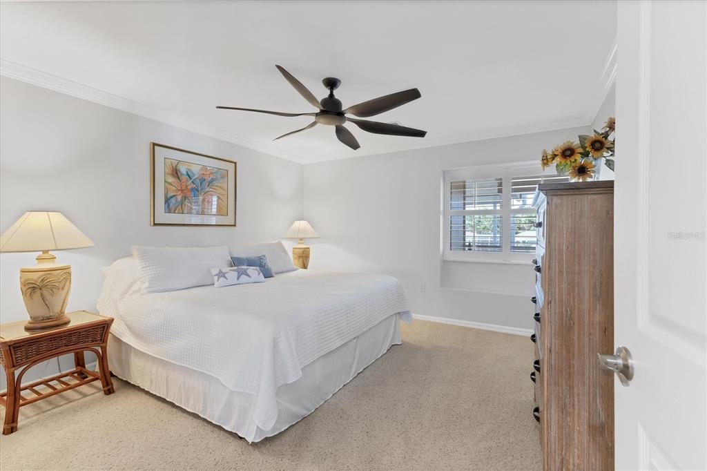 11000 Placida Road, Unit 1603 Placida, FL 33946 - Photo 17 of 44 a bedroom with a bed and a painting on the wall