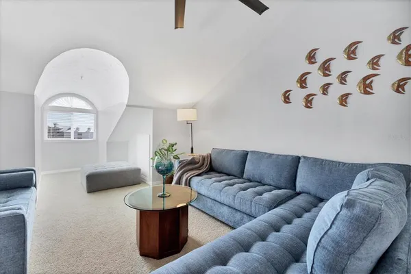 a living room with furniture and white walls