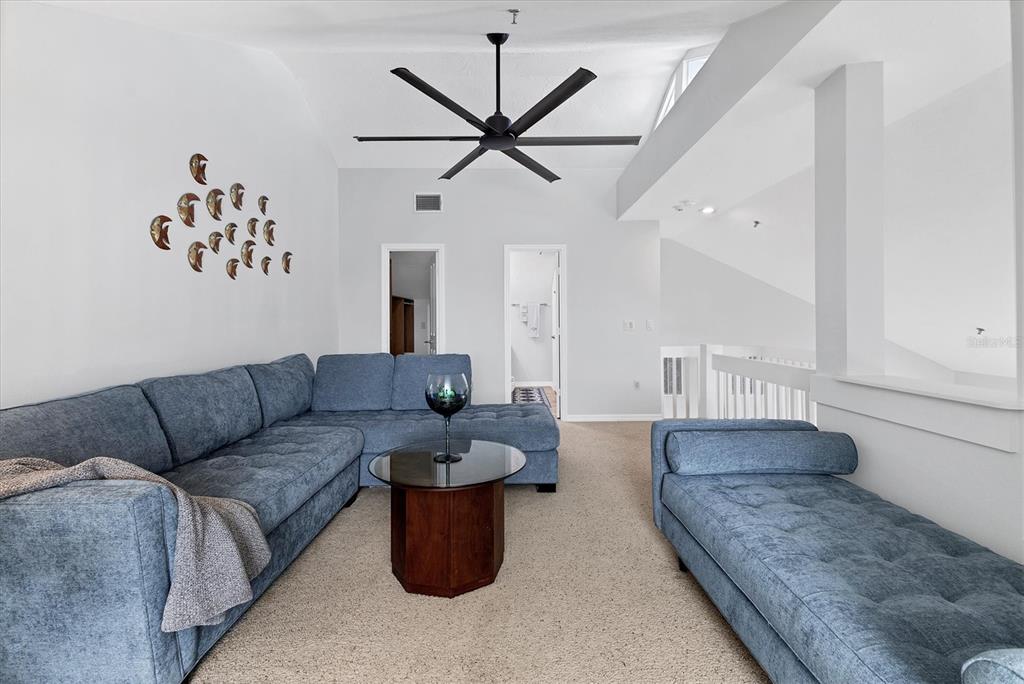 11000 Placida Road, Unit 1603 Placida, FL 33946 - Photo 21 of 44 a living room with furniture and a ceiling fan