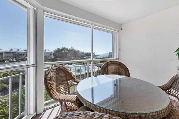 a view of a balcony dining area