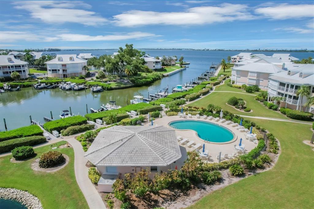 11000 Placida Road, Unit 1603 Placida, FL 33946 - Photo 32 of 34 a view of a house with a yard and a pond