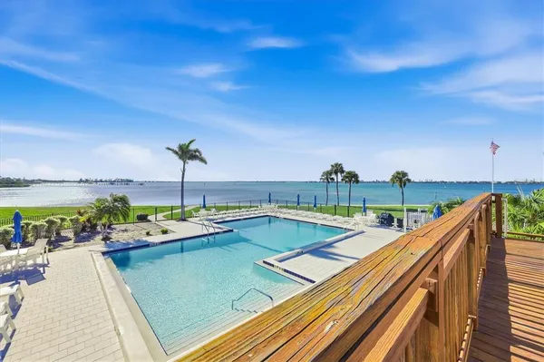 a view of a patio with swimming pool