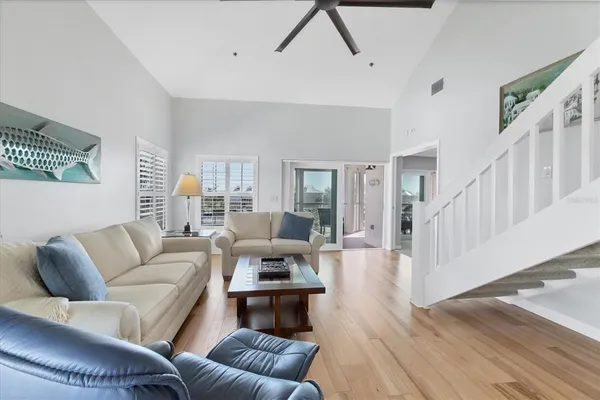 a living room with furniture or wooden floor and a table