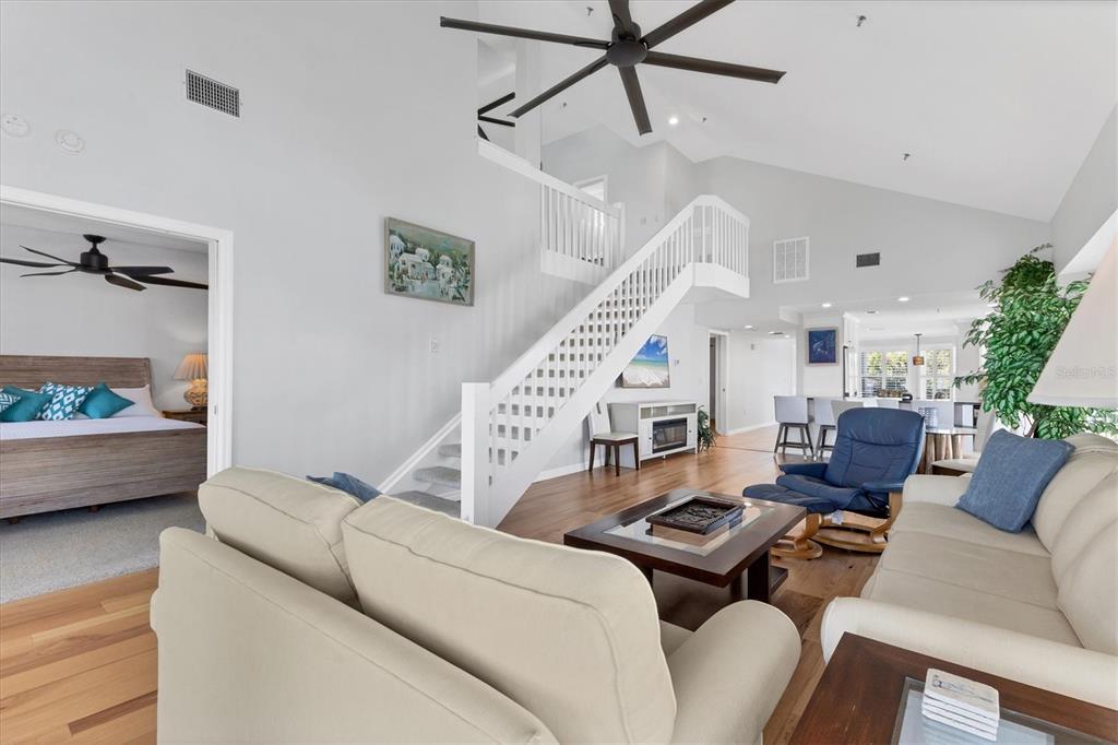 11000 Placida Road, Unit 1603 Placida, FL 33946 - Photo 5 of 44 a living room with furniture and a wooden floor