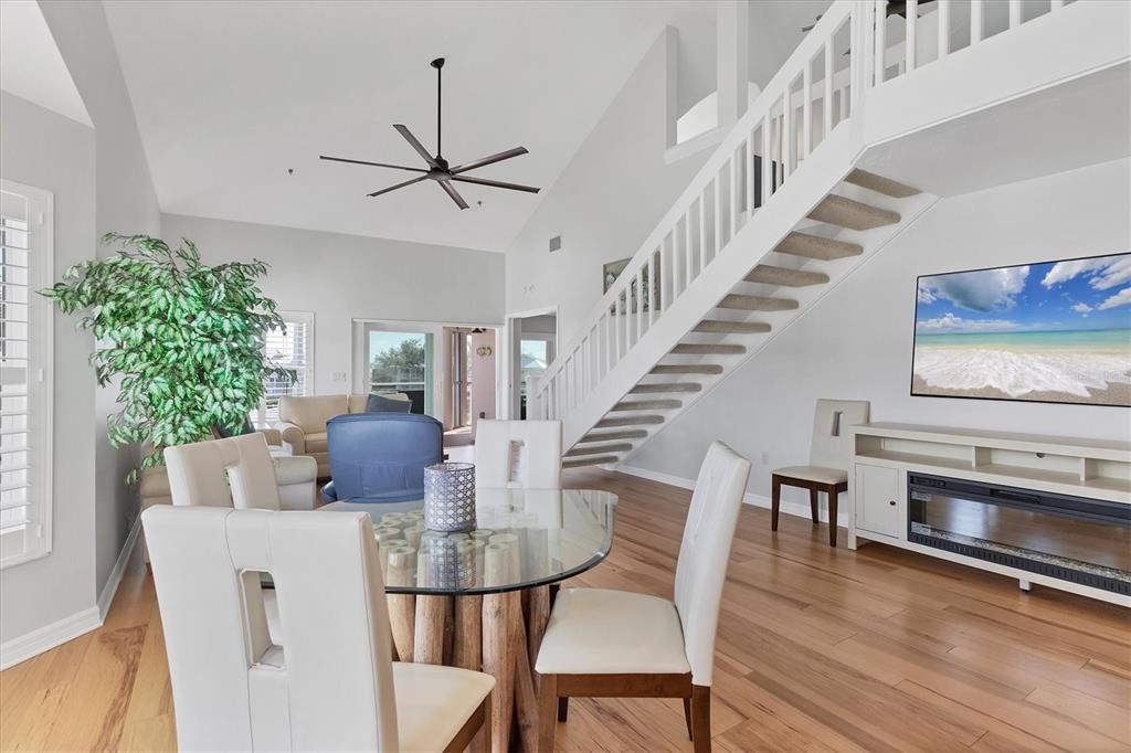 11000 Placida Road, Unit 1603 Placida, FL 33946 - Photo 6 of 34 a view of a dining room with furniture window and wooden floor