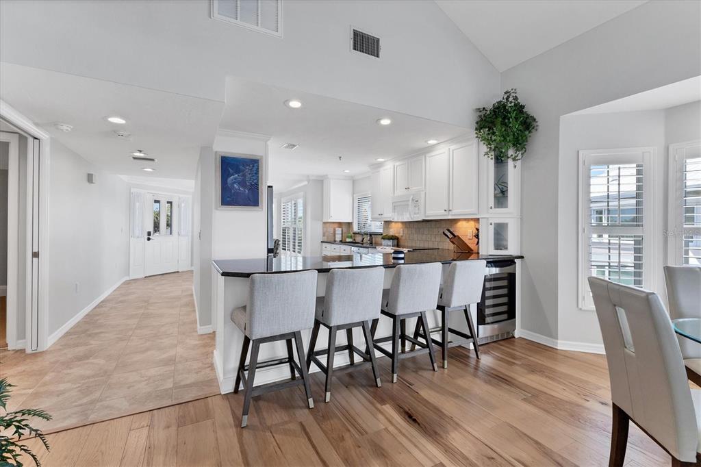 11000 Placida Road, Unit 1603 Placida, FL 33946 - Photo 7 of 34 a view of a dining room with furniture and wooden floor