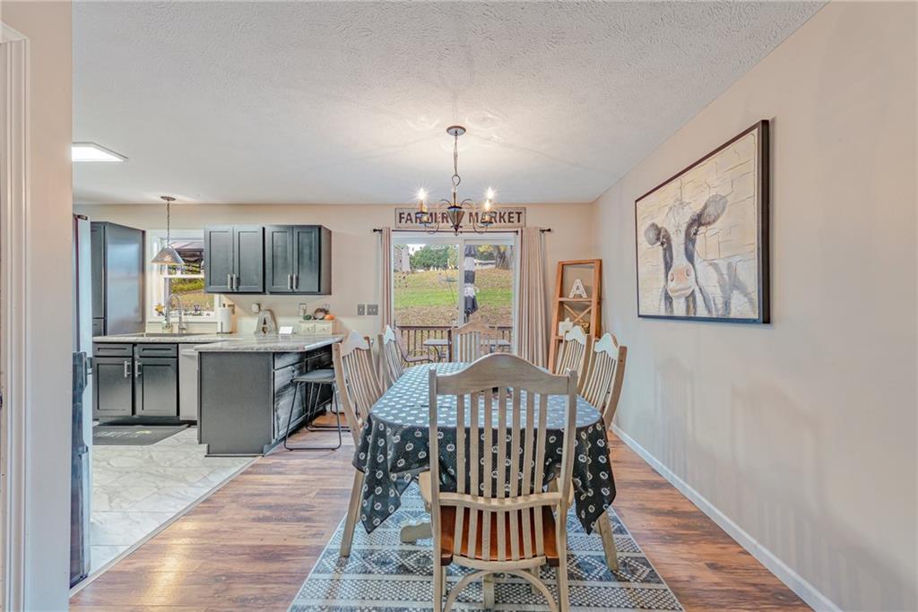 336 Parker Road Sarver, PA 16055 - Photo 11 of 21 a view of a dining room with furniture window and wooden floor