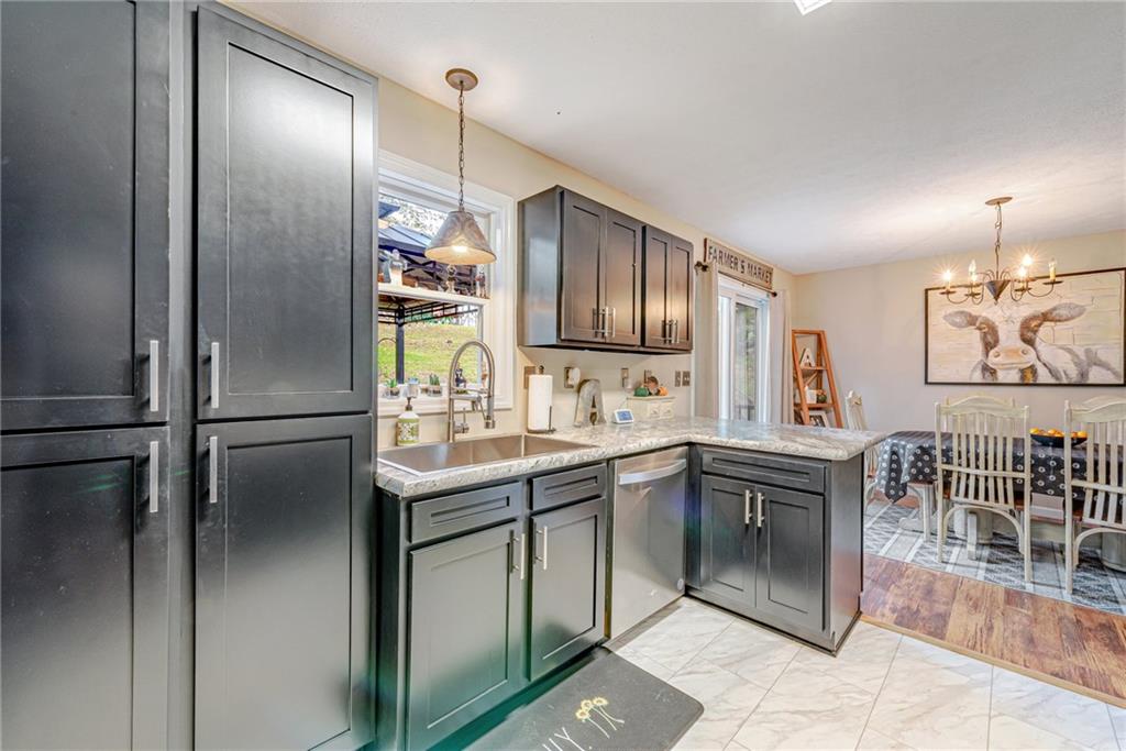 336 Parker Road Sarver, PA 16055 - Photo 14 of 21 a kitchen with stainless steel appliances granite countertop a refrigerator and a sink