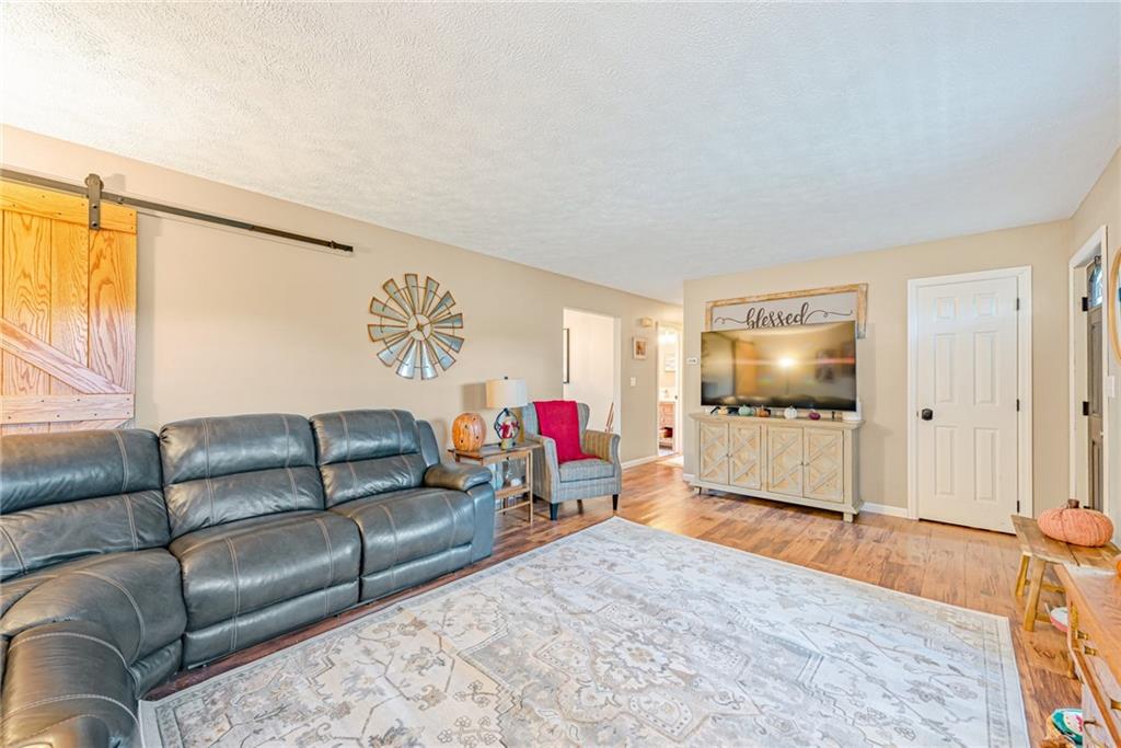 336 Parker Road Sarver, PA 16055 - Photo 5 of 21 a living room with furniture and a flat screen tv