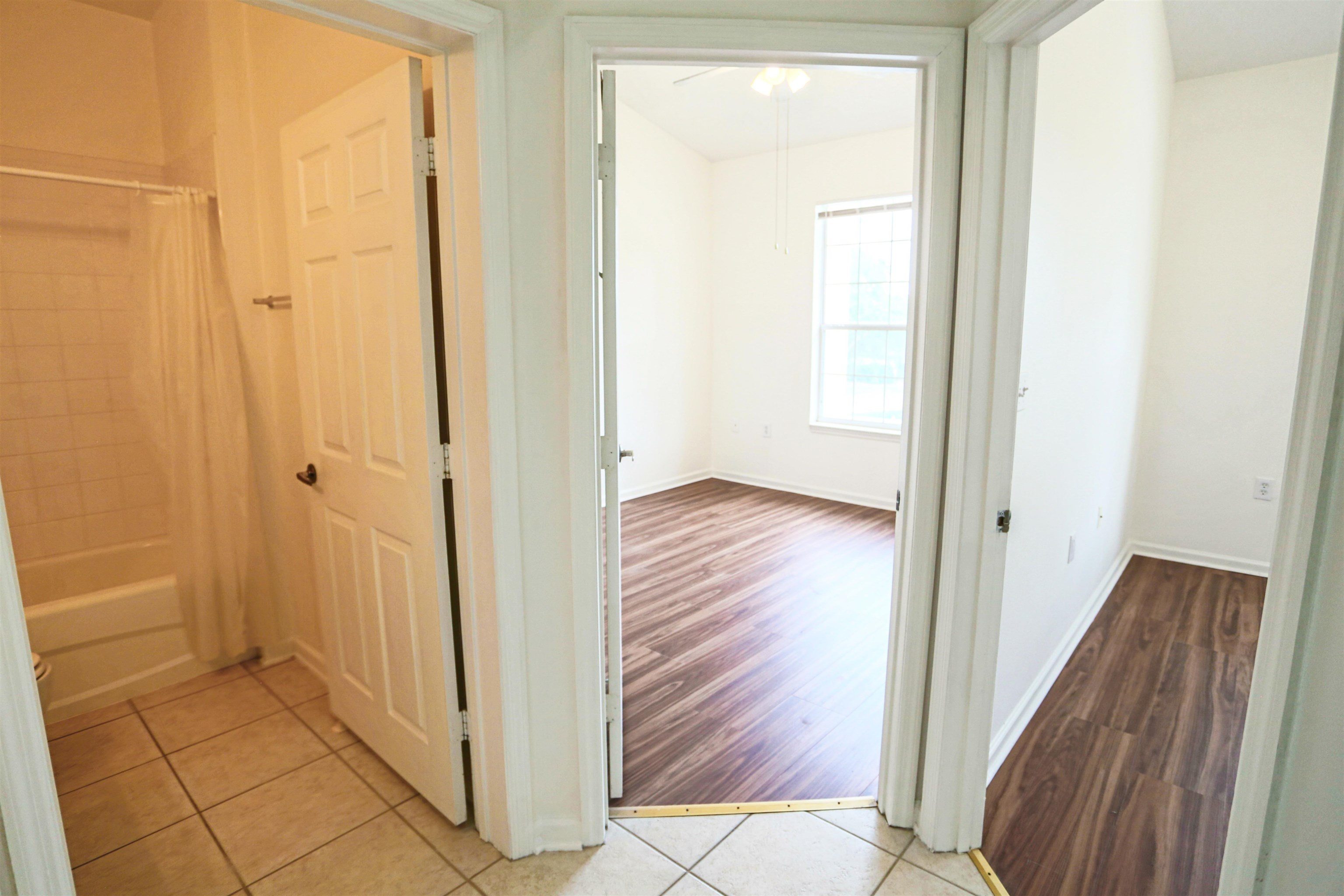 1603 Prestwick Place St. Augustine, FL 32086 - Photo 29 of 44 a view of a hallway with wooden floor and a bathroom