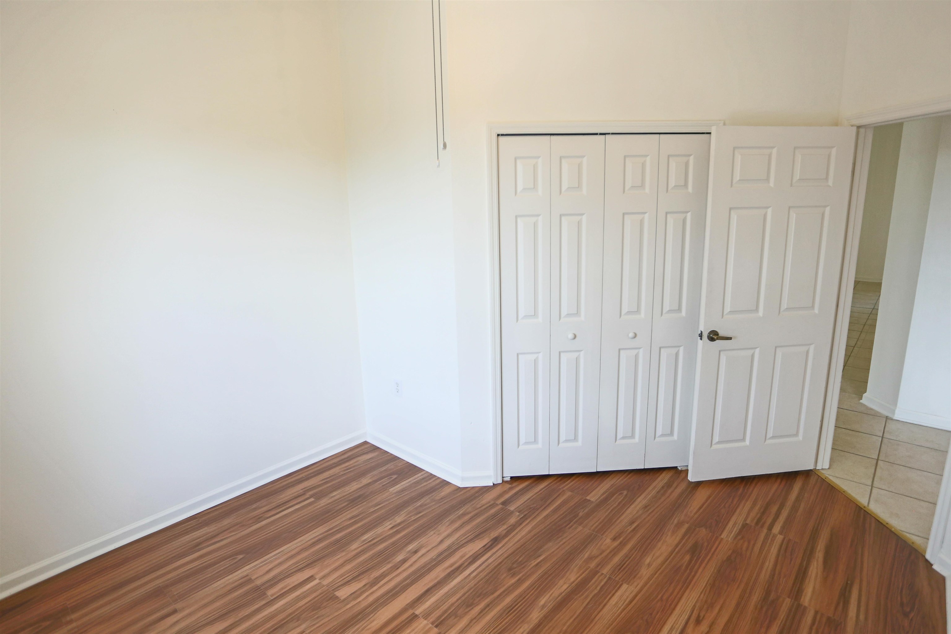 1603 Prestwick Place St. Augustine, FL 32086 - Photo 32 of 44 a view of an empty room with wooden floor