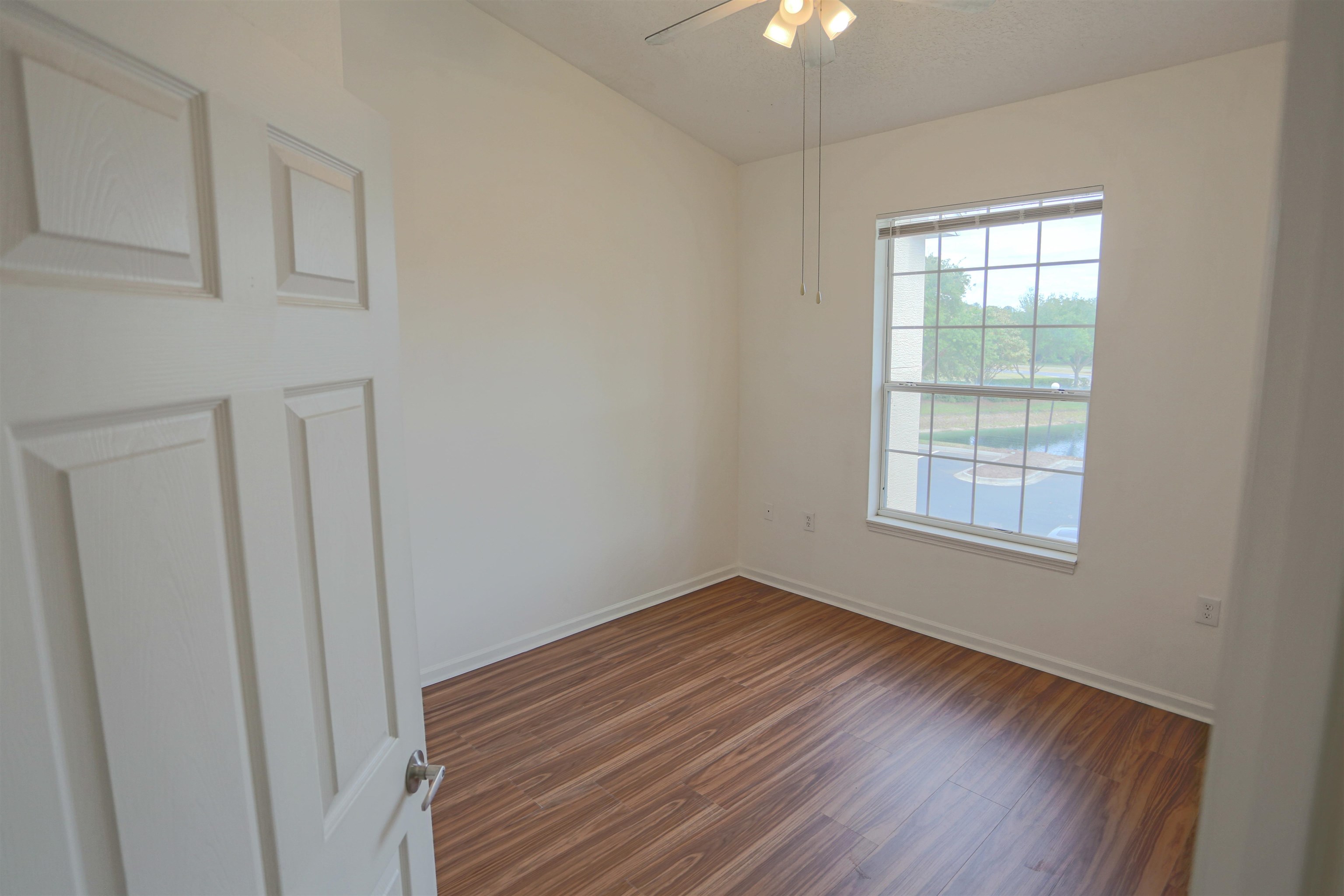 1603 Prestwick Place St. Augustine, FL 32086 - Photo 34 of 44 wooden floor in an empty room with a window