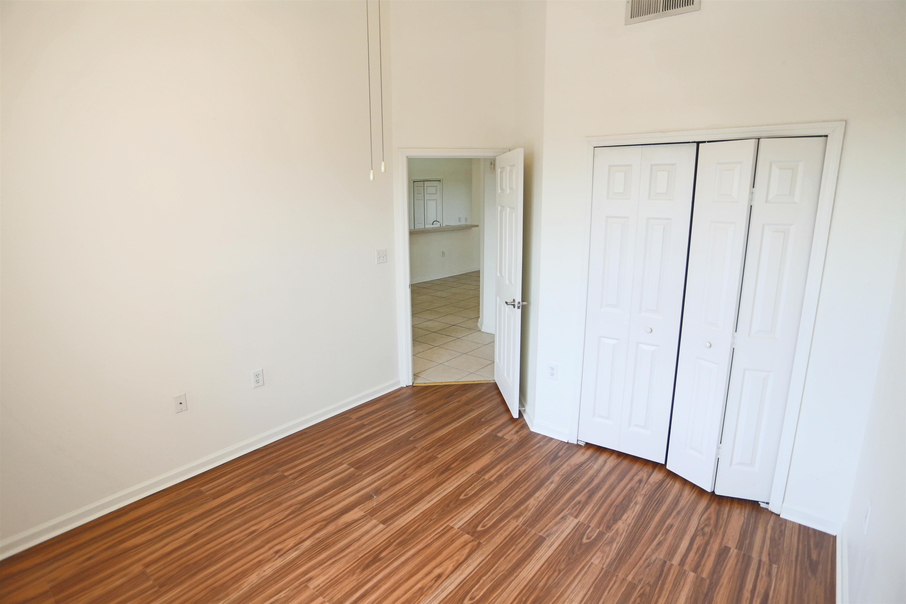 1603 Prestwick Place St. Augustine, FL 32086 - Photo 36 of 44 a view of an empty room with wooden floor