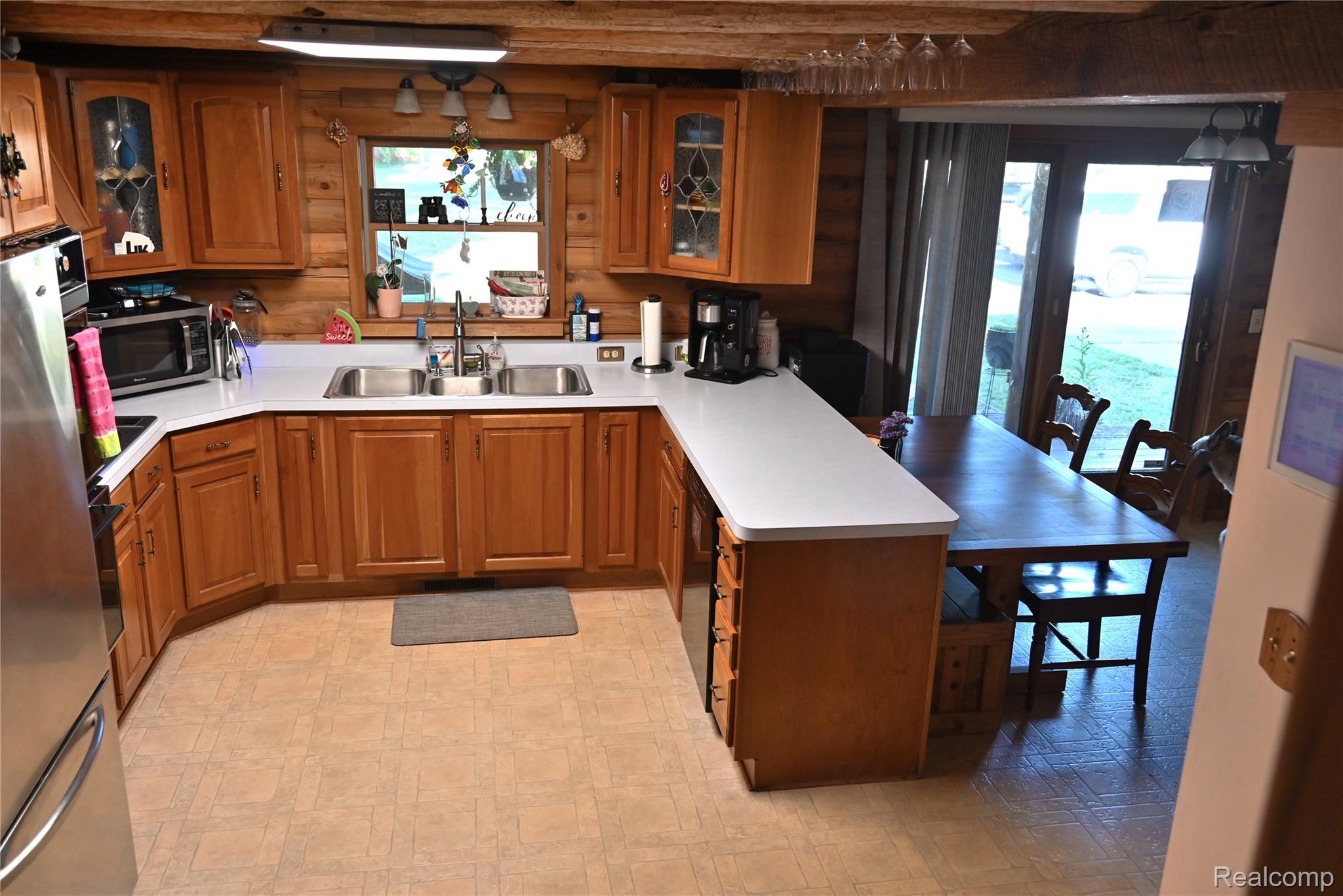 16501 Hannan Road Romulus, MI 48174 - Photo 6 of 20 Kitchen featuring wood cabinetry, light countertops, and double basin sink