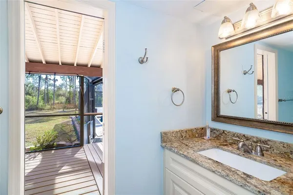 a view of a workspace with furniture and a workspace