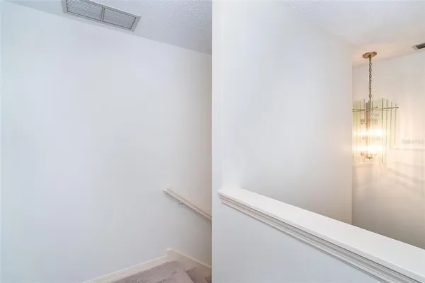 a kitchen with a refrigerator a stove a sink dishwasher with a dining table and chairs