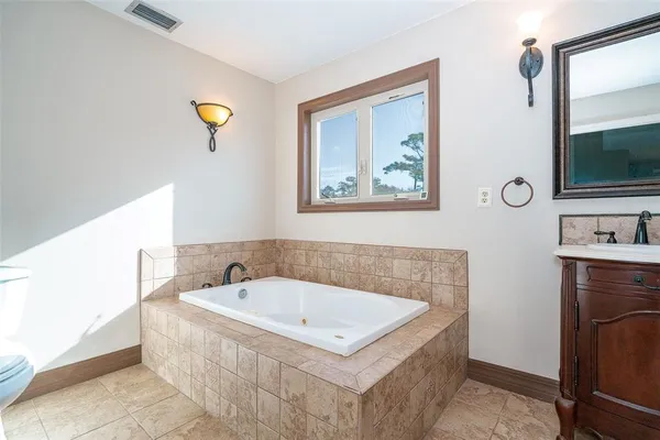 an aerial view of residential house with outdoor space and swimming pool