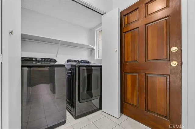 a utility room with washer and dryer