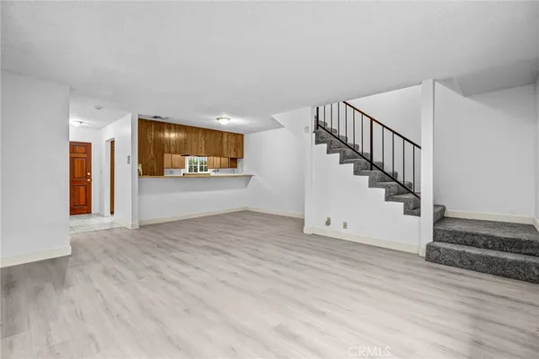 a room with wooden floor and window