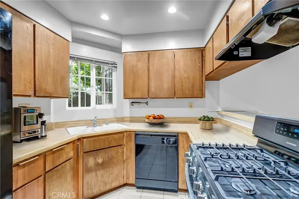 a kitchen with a stove and a sink