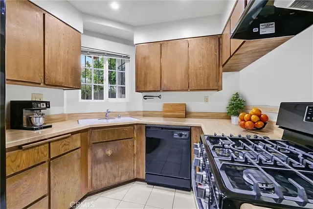 a bedroom with a bed and a potted plant