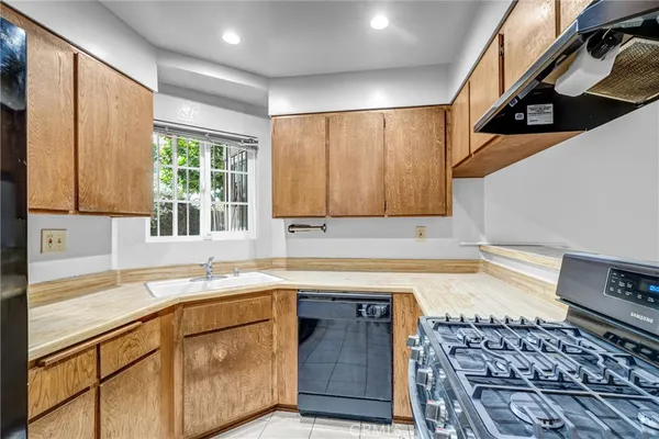 a kitchen with a stove and a sink