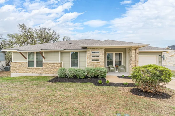 front view of a house with a yard