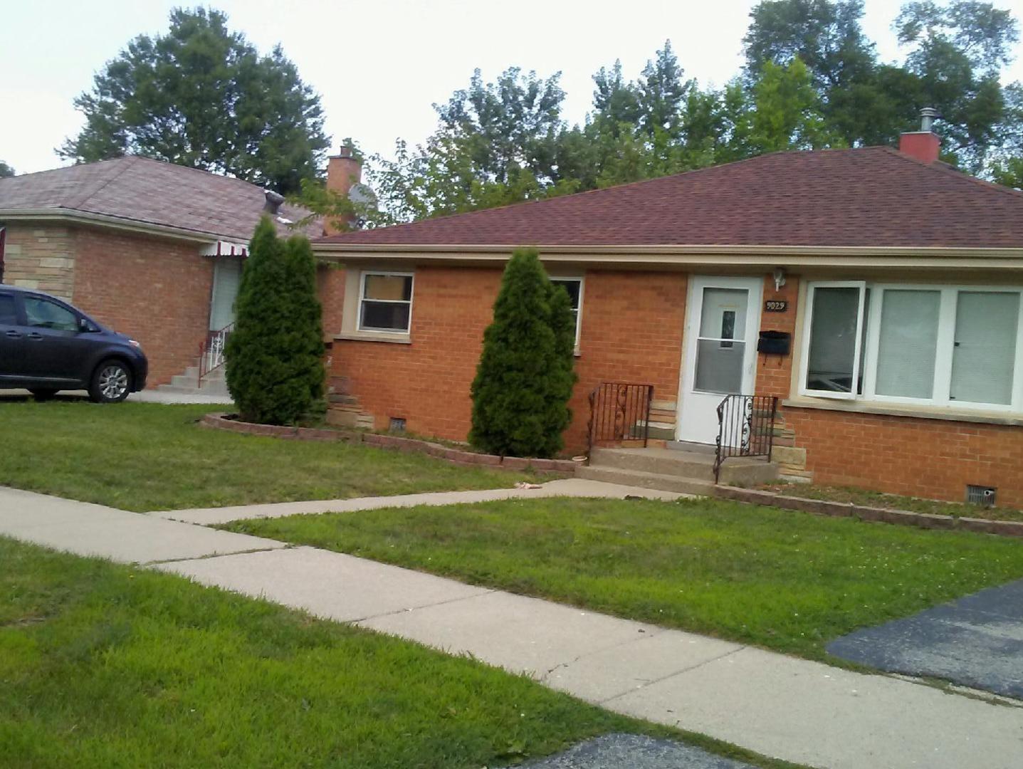9029 Sproat Avenue Oak Lawn, IL 60453 - Photo 1 of 8 a view of a house with a yard plants and large tree