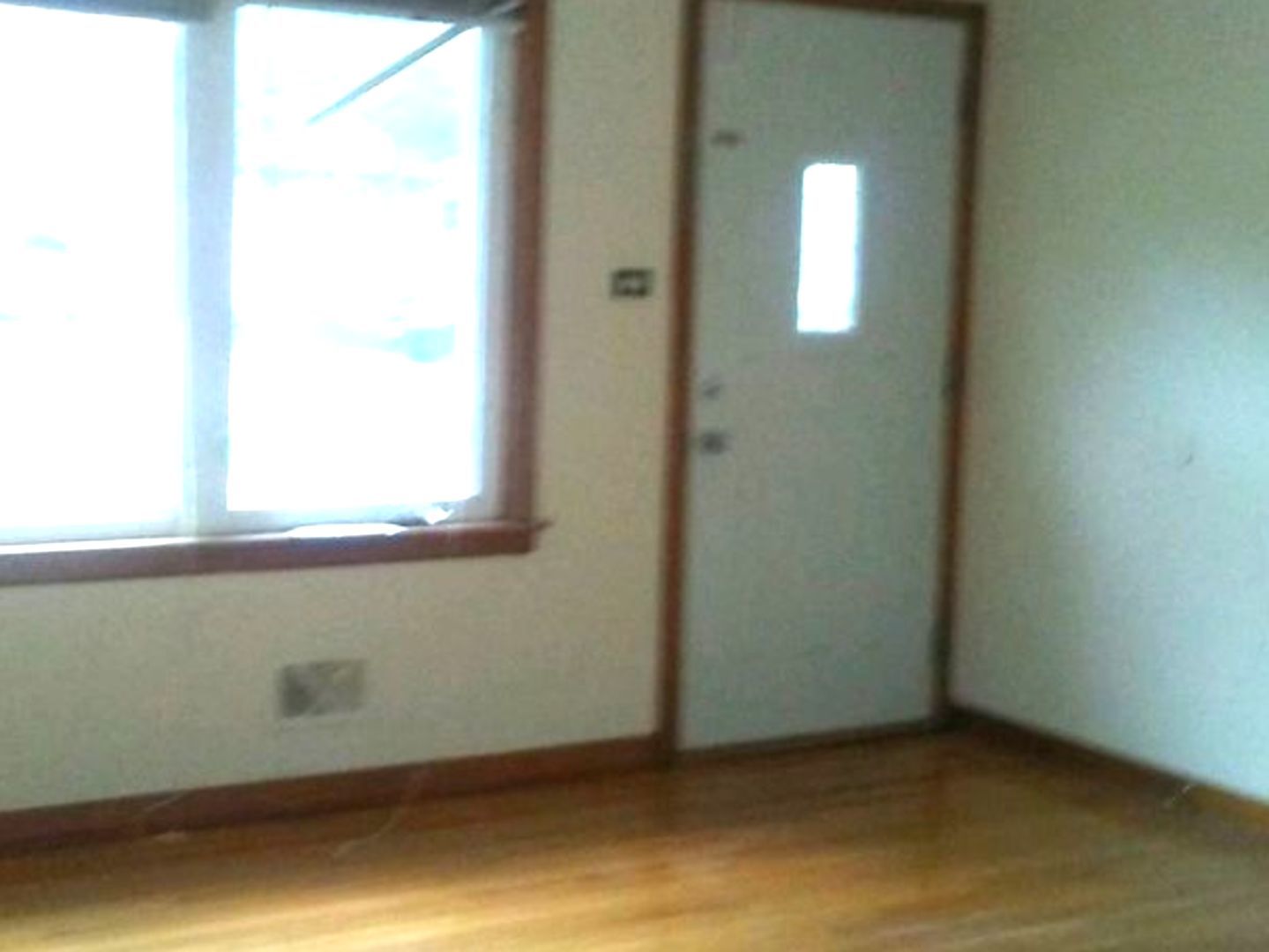 9029 Sproat Avenue Oak Lawn, IL 60453 - Photo 3 of 8 a view of an empty room with a window