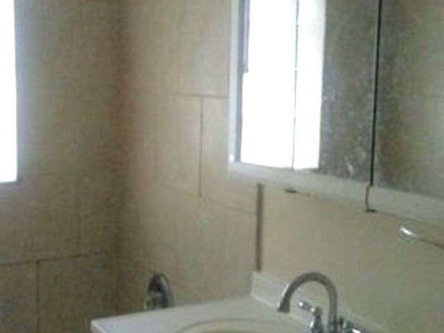 9029 Sproat Avenue Oak Lawn, IL 60453 - Photo 6 of 8 a bathroom with a sink and a toilet