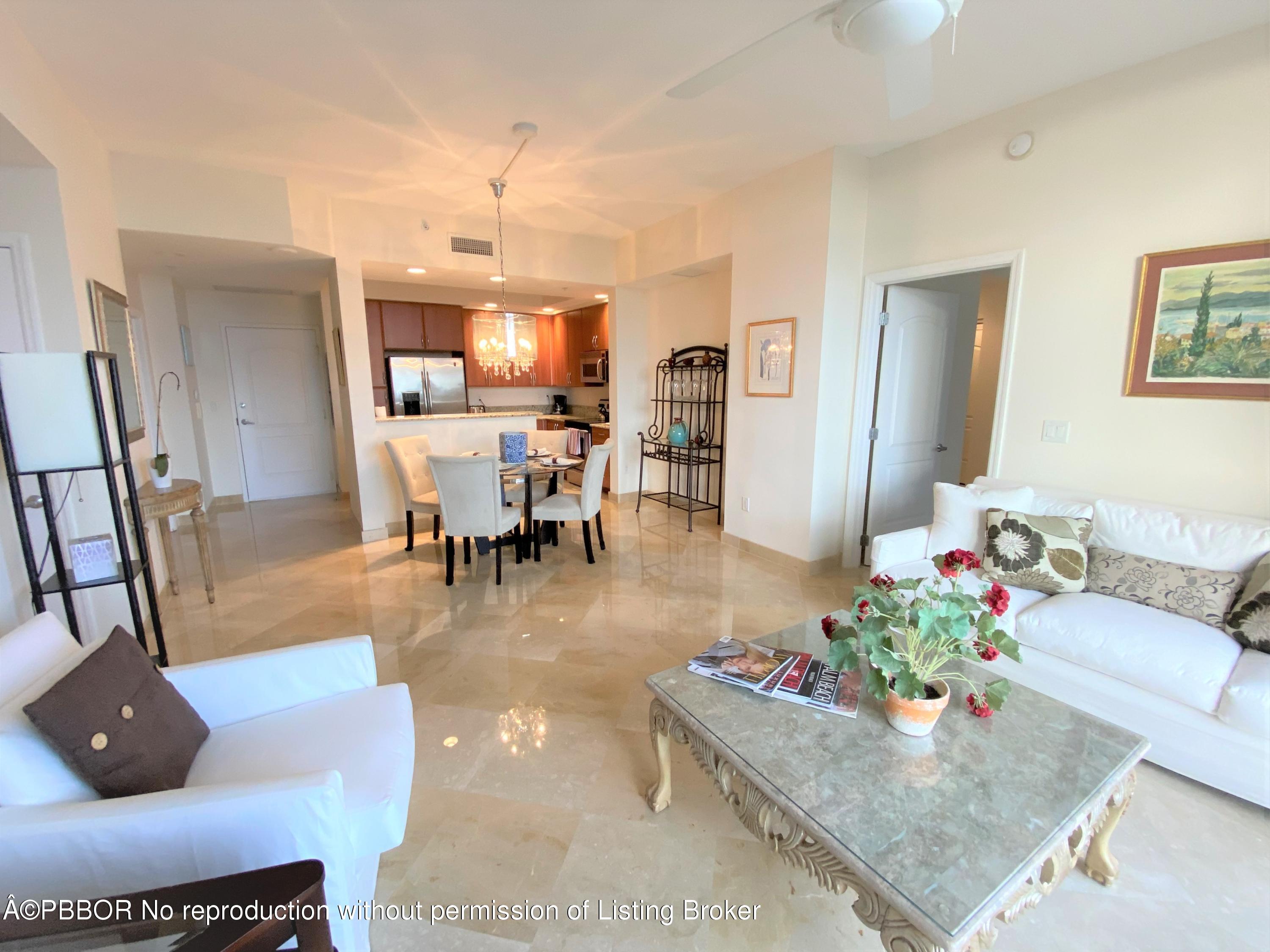 801 South Olive Avenue, Unit 903 West Palm Beach, FL 33401 - Photo 15 of 55 a living room with furniture and a dining table