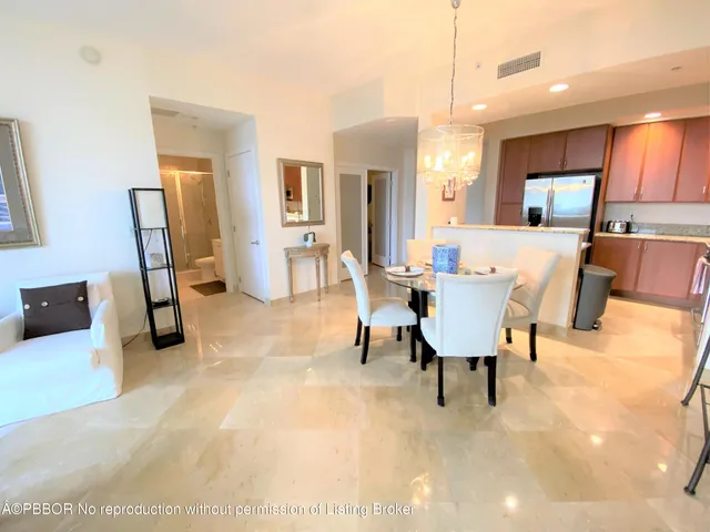 a view of a livingroom with furniture and a flat screen tv