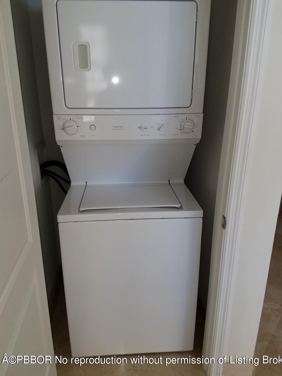 801 South Olive Avenue, Unit 903 West Palm Beach, FL 33401 - Photo 36 of 55 a close up view of a washer and dryer