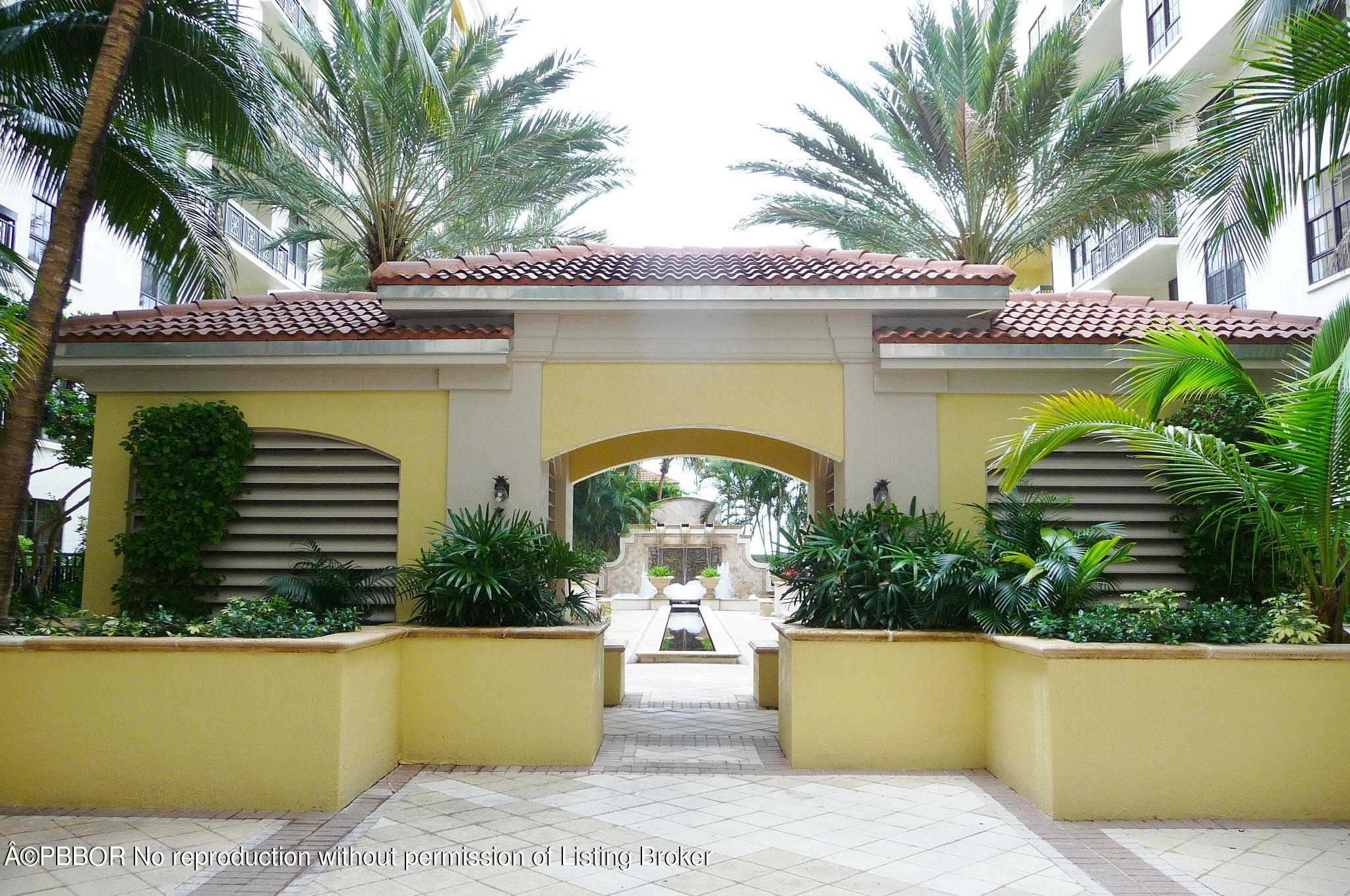 801 South Olive Avenue, Unit 903 West Palm Beach, FL 33401 - Photo 52 of 55 a front view of a house with garden