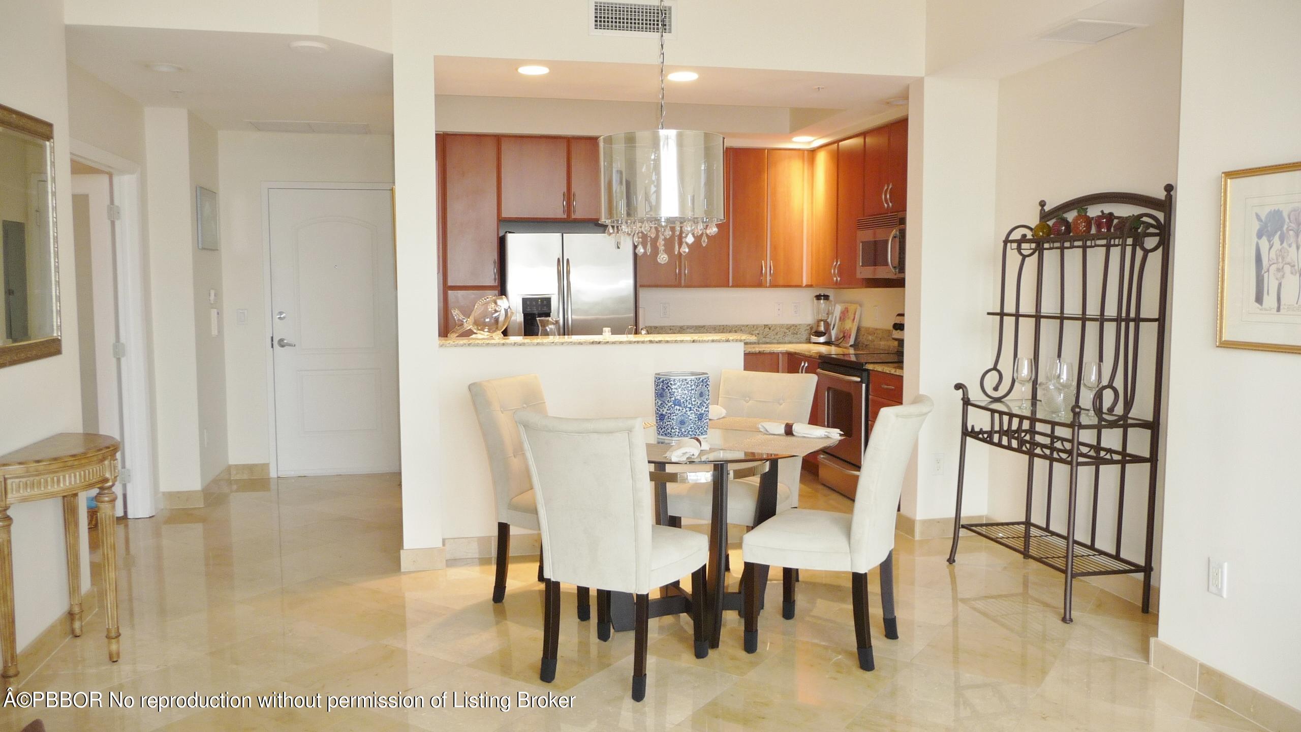 801 South Olive Avenue, Unit 903 West Palm Beach, FL 33401 - Photo 10 of 55 a view of a dining room with furniture