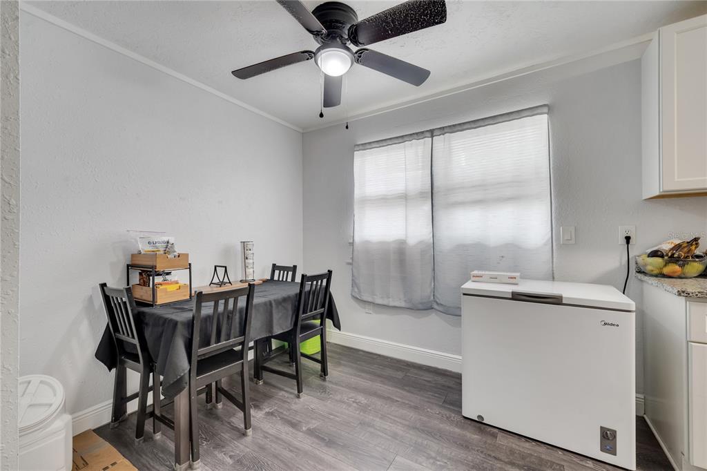 1226 Pine Street Orlando, FL 32824 - Photo 12 of 46 a view of a dining room with furniture and chandelier