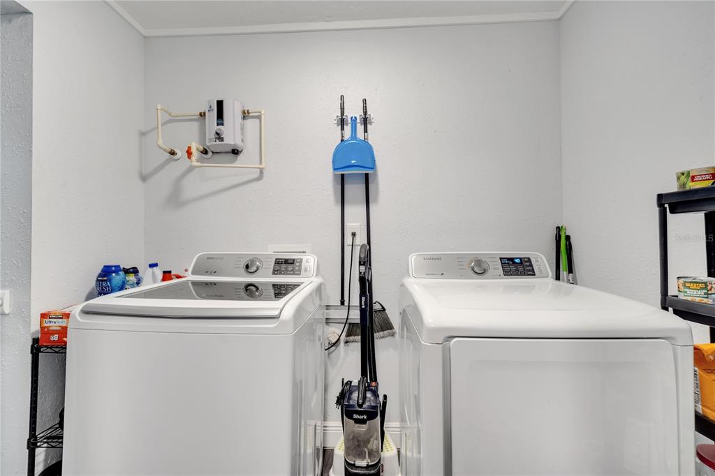 1226 Pine Street Orlando, FL 32824 - Photo 18 of 46 a utility room with dryer and washer