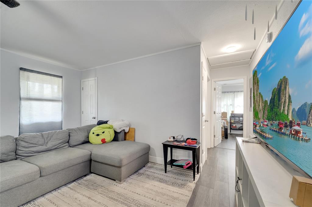 1226 Pine Street Orlando, FL 32824 - Photo 23 of 46 a living room with furniture and wooden floor