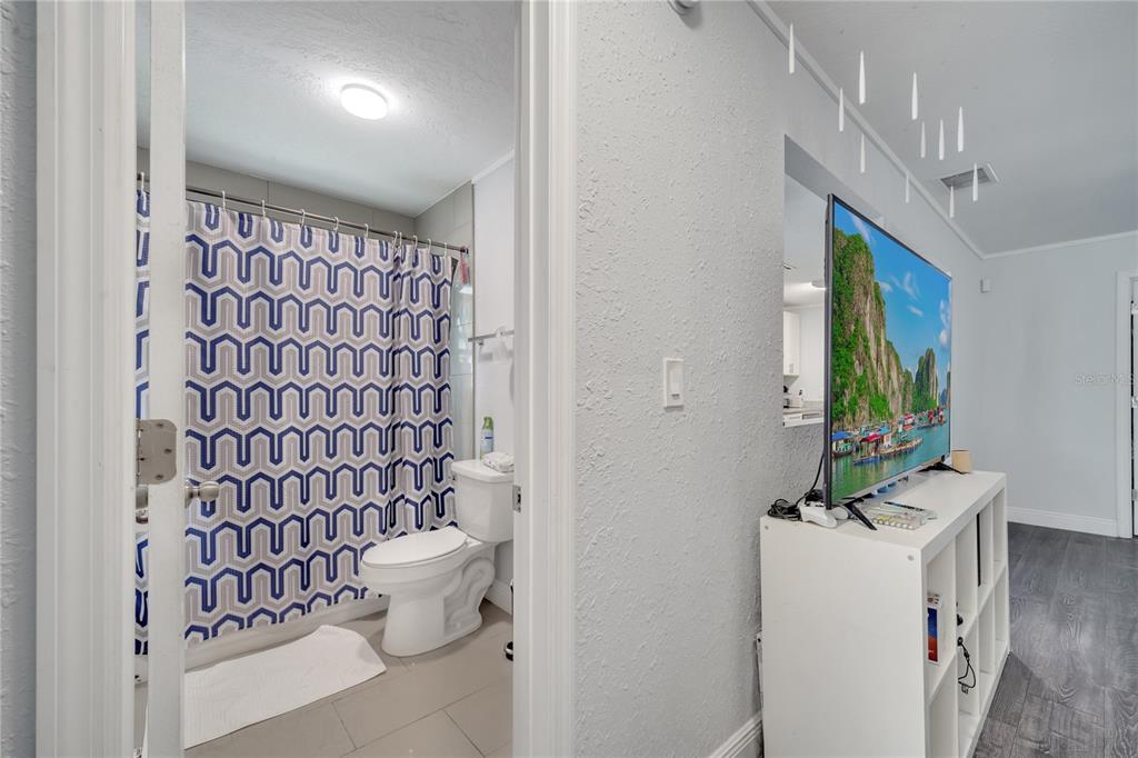 1226 Pine Street Orlando, FL 32824 - Photo 25 of 46 a bathroom with a sink toilet and shower