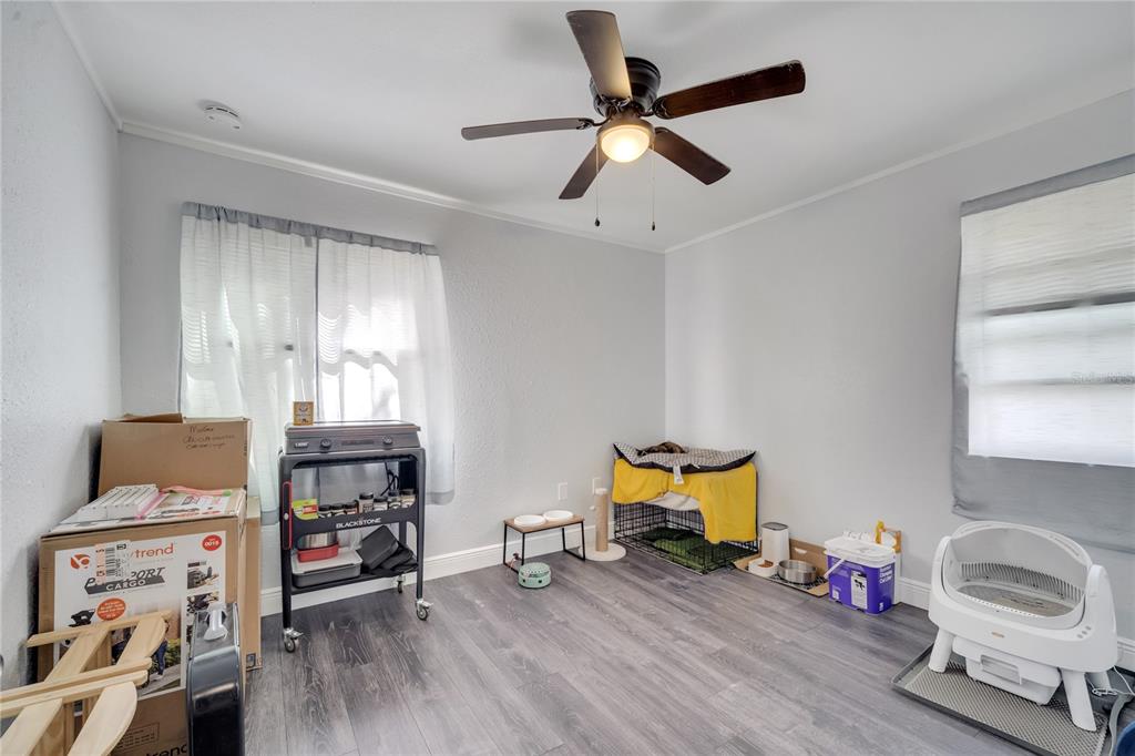 1226 Pine Street Orlando, FL 32824 - Photo 29 of 46 a bedroom with furniture and a wooden floor