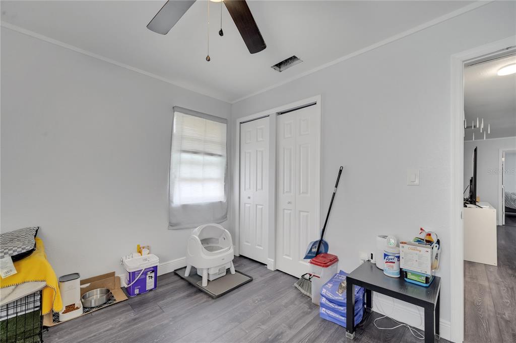 1226 Pine Street Orlando, FL 32824 - Photo 30 of 46 a living room with furniture and a flat screen tv