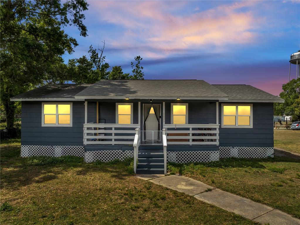 1226 Pine Street Orlando, FL 32824 - Photo 34 of 46 a front view of a house with a yard