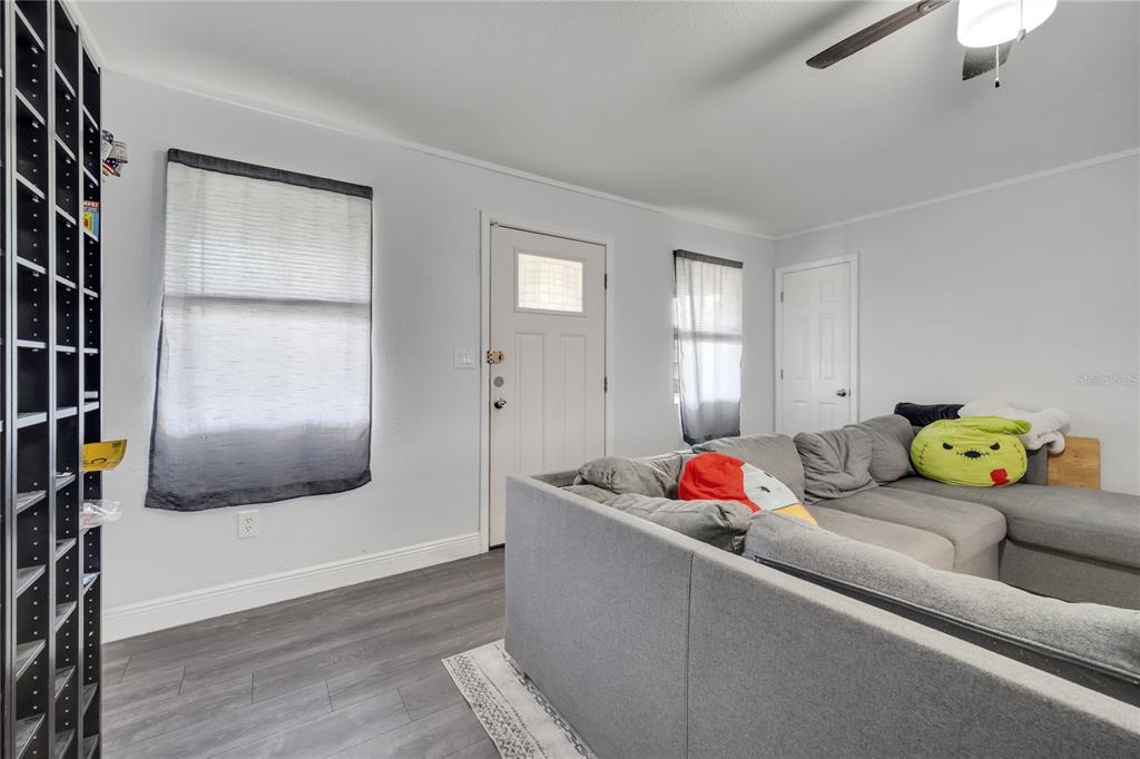 1226 Pine Street Orlando, FL 32824 - Photo 6 of 46 a living room with furniture and a window