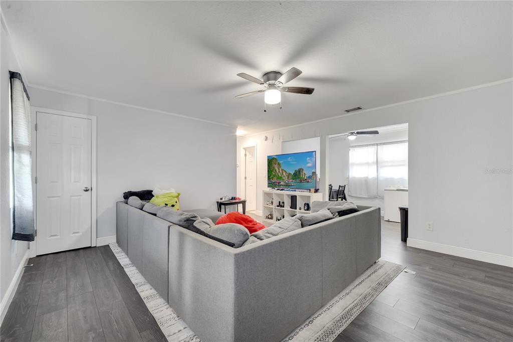 1226 Pine Street Orlando, FL 32824 - Photo 8 of 46 a living room with furniture and window