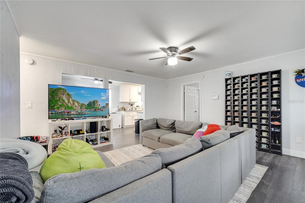 1226 Pine Street Orlando, FL 32824 - Photo 9 of 46 a living room with furniture and a flat screen tv