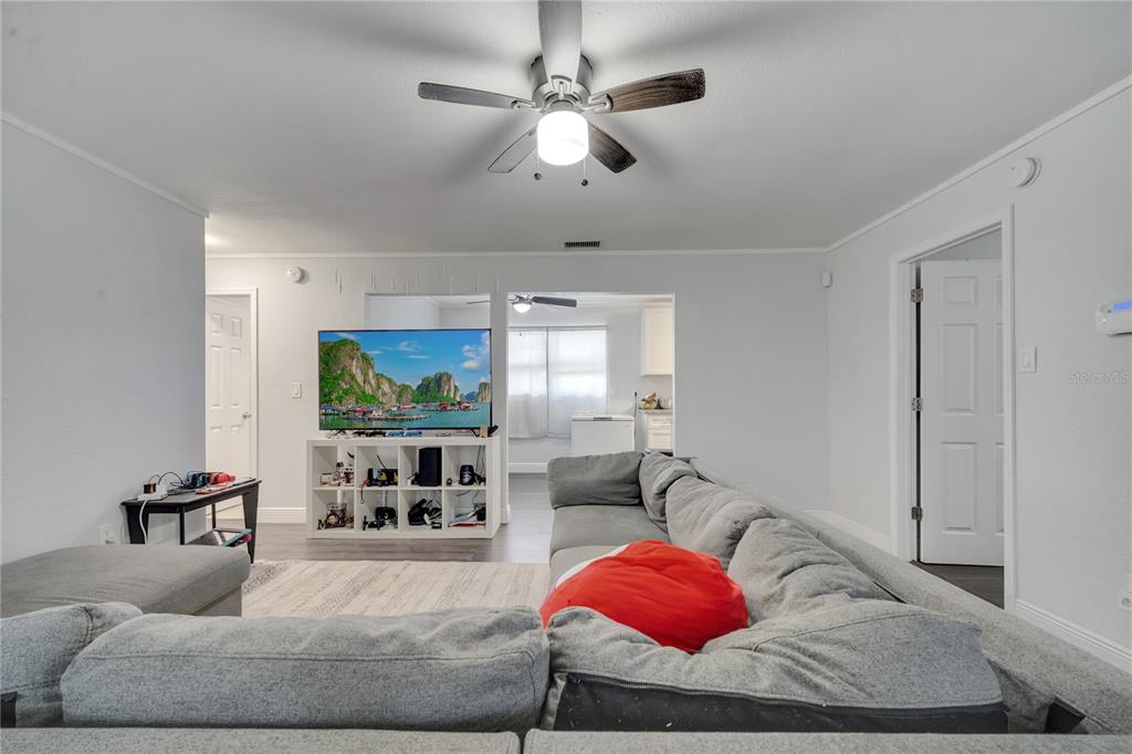 1226 Pine Street Orlando, FL 32824 - Photo 10 of 46 a living room with furniture and a flat screen tv