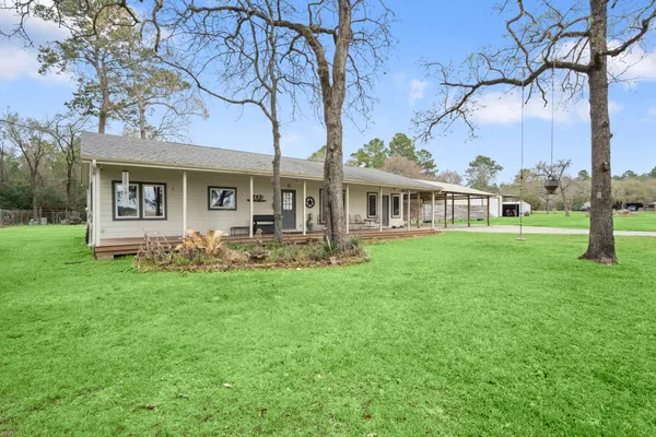 a front view of a house with yard table and chairs